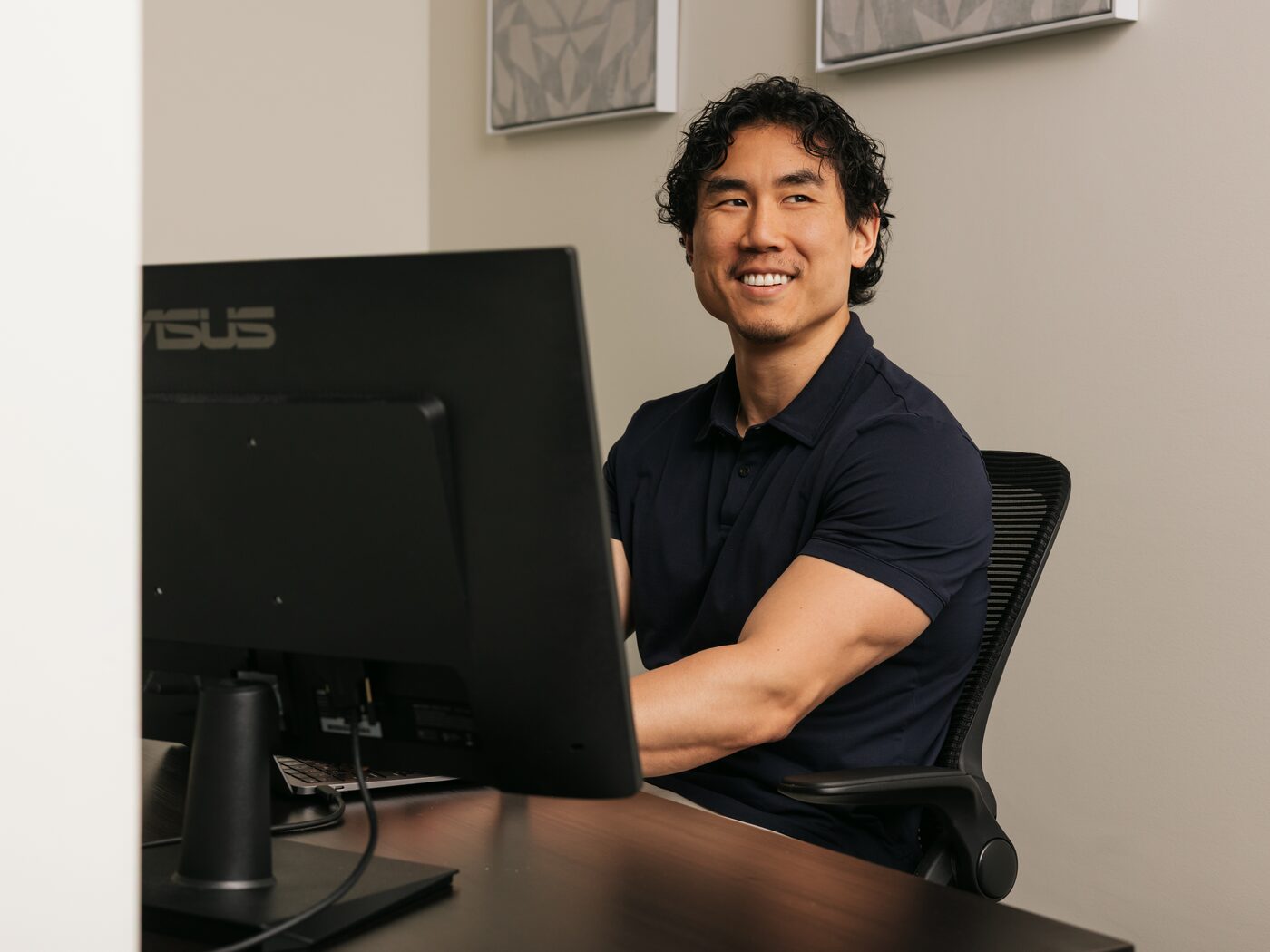 David Chung at his workstation in the Integrity Marketing office