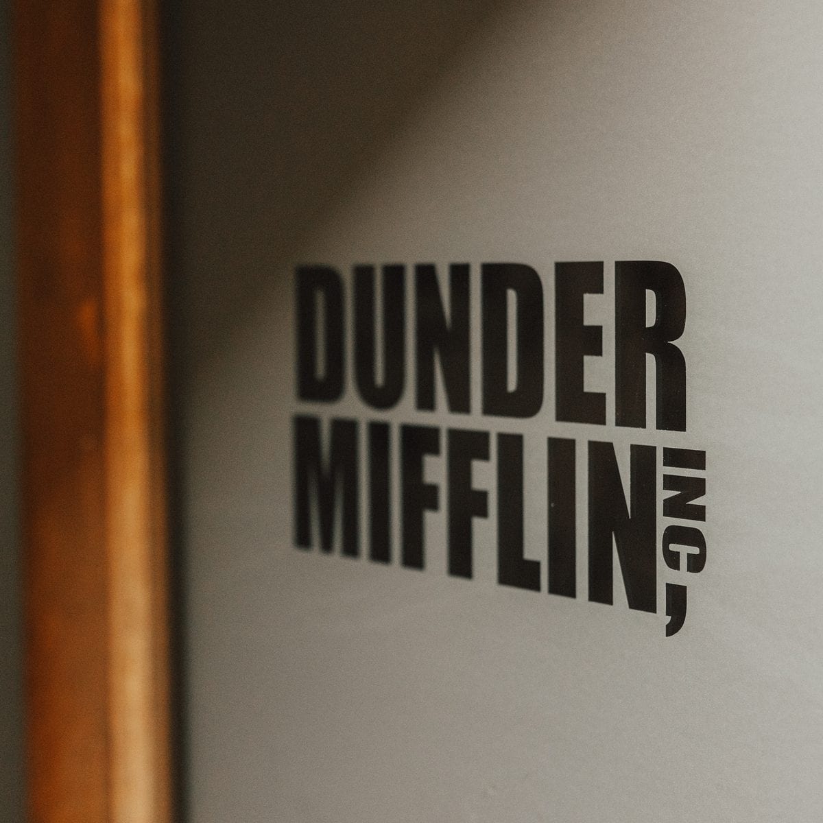 Dunder Mifflin sign in the Integrity office